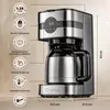 A coffee maker with feature callouts and dimensions. Voir les images du produit