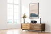 A modern living room with a wooden sideboard displaying a radio and decorative items. Náhľad obrázku produktu