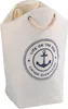 A white canvas laundry bag with a blue anchor logo and nautical text. Produktbild-Vorschau