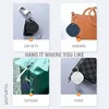 A collage of four images showing a Bluetooth tracker attached to car keys, a handbag, a suitcase, and a purse. Anteprima dell’immagine prodotto