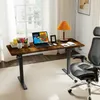 A home office setup with an adjustable desk, chair, and laptop. Voir les images du produit