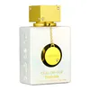 A white perfume bottle with gold accents and a gold circular charm hanging from the neck. Anteprima dell’immagine prodotto