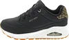 A side view of a black Skechers sneaker with a white sole and a leopard print accent on the heel. Voir les images du produit