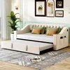 A beige upholstered daybed with a pull-out trundle bed is set up in a living room with decorative pillows and artwork on the wall. Anteprima dell’immagine prodotto
