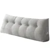 A gray tufted wedge pillow with side pockets, presented against a white background. Produktbild-Vorschau