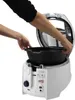 A person is placing a black bowl into a white deep fryer. Anteprima dell’immagine prodotto