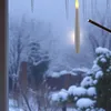 LED candles hanging in front of a snowy window. Náhľad obrázku produktu