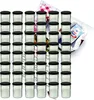 A large set of glass jars with black lids, arranged in stacks, with a recipe booklet in the background. Náhled obrázku produktu