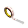A roll of double-sided tape with a portion unrolled. Produktbild-Vorschau