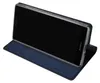 A dark blue flip case for a Sony Xperia XZ2 Compact phone is shown, with the phone inserted and its screen facing upwards. Náhled obrázku produktu