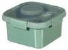 A green lunch box with a transparent lid and a utensil holder inside. Podgląd zdjęcia produktu