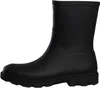 A side view of a black short Wellington boot. Produktbild-Vorschau