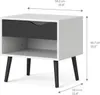 A white nightstand with a black drawer and shelf, supported by four black legs. Anteprima dell’immagine prodotto