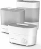 Three white and gray baby bottle sterilizers are arranged in a group on a white background. Produktbild-Vorschau