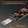 A smartphone connected to a USB stick via an OTG adapter, with text overlays describing its functionality. Produktbild-Vorschau
