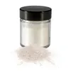 A small glass jar filled with silver edible glitter powder, with a pile of the powder spilled in front of it, on a white background. Anteprima dell’immagine prodotto