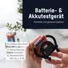 A hand holding a battery and a battery tester, with other batteries in the background. Podgląd zdjęcia produktu