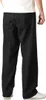 A person wearing black jeans. Produktbild-Vorschau