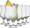 A set of hurricane glasses, with one glass filled with a creamy cocktail and garnished with a pineapple slice and a cherry. Podgląd zdjęcia produktu