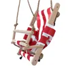 A baby swing seat with red and white stripes, made of wood and fabric, suspended by ropes. Produktbild-Vorschau