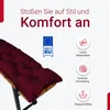 A close-up of a burgundy cushion on a bench, with marketing text and icons. Produktbild-Vorschau