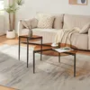 A living room scene with a sofa, coffee tables, and a plant. Voir les images du produit