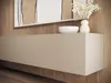A close-up view of a modern, minimalist TV lowboard with decorative items on top, set against a wooden wall. Náhľad obrázku produktu