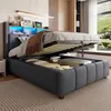 A modern bedroom with a bed featuring a storage compartment and LED lighting. Produktbild-Vorschau