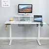 A white adjustable standing desk with a monitor, laptop, and accessories. Anteprima dell’immagine prodotto