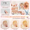 A collage of images showing a child's play vanity set, including close-ups of battery compartment and controls, a girl applying makeup in the mirror, and different lighting options for the mirror. Produktbild-Vorschau