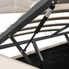 Close-up view of the internal mechanism of a bed frame, showing a gas lift strut. Podgląd zdjęcia produktu