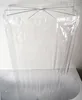 A transparent shower curtain hanging over a bathtub. Produktbild-Vorschau