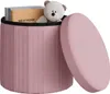 A pink storage ottoman with its lid open, revealing a teddy bear and books inside.