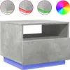 A concrete-effect bedside table with blue LED lighting at the base, shown against a white background. Three circular insets at the top show close-ups of the table's edges with different colored LED lights (yellow, red, green). A color wheel graphic is also Produktbild-Vorschau