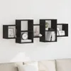 A black wooden wall shelf unit mounted on a white wall. Náhľad obrázku produktu