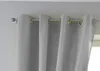 Close-up of gray curtains hanging from a curtain rod. Produktbild-Vorschau
