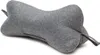 A grey bone-shaped pillow is shown against a white background. Produktbild-Vorschau