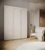 A bedroom or dressing room setting with a wardrobe, chair, and rug. Produktbild-Vorschau