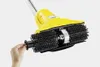 A hand is shown attaching a part to a yellow cleaning brush attachment for a stick vacuum. Voir les images du produit