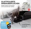 A cat is walking on a litter box mat in front of an open litter box. The background shows a shelf with binders and a litter box with litter scattered around it, marked with a red 'X'. Produktbild-Vorschau