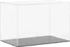 A clear acrylic display box with a gray base, shown from a slightly elevated side angle against a white background. Náhľad obrázku produktu
