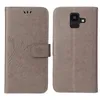 A flip phone case is shown open and closed, displaying its floral design. Produktbild-Vorschau