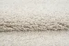 A close-up view of a beige shaggy rug, showing the texture of the fibers. Anteprima dell’immagine prodotto