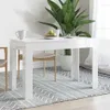 A white dining table with chairs and a plant in a room. Produktbild-Vorschau