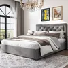 A bedroom scene with a bed, chandelier, and artwork. Náhľad obrázku produktu