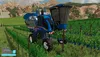 A blue and gray agricultural machine is driving through a vineyard. Náhled obrázku produktu