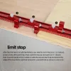 A red woodworking tool with measurement markings is placed on a wooden surface, with numbered labels and instructional text below. Podgląd zdjęcia produktu