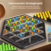 A close-up of a triangular strategy board game with colorful pieces, placed on a table with other game pieces and a hint of a decorative item in the background. Produktbild-Vorschau