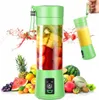 A portable blender filled with fruit and surrounded by various fruits. Náhled obrázku produktu