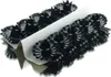 A stack of black candle holders with fluted edges, arranged in rows and separated by a white cardboard divider. Produktbild-Vorschau